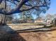 The expansive backyard has play equipment and a storage shed, providing ample space for recreation and storage at 4437 Garwood Dr, Ladson, SC 29456