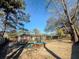 Spacious backyard featuring mature trees, offering shade and privacy for outdoor enjoyment at 4437 Garwood Dr, Ladson, SC 29456