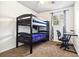 A bedroom with a bunk bed, an office chair, a window, and carpet flooring at 4437 Garwood Dr, Ladson, SC 29456