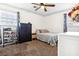 A bedroom with a queen bed, a dresser, two windows, and carpet flooring at 4437 Garwood Dr, Ladson, SC 29456