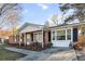 Beautiful brick home with a cozy porch and manicured landscaping at 4437 Garwood Dr, Ladson, SC 29456