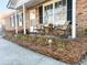 Relaxing front porch with seating and landscaping at 4437 Garwood Dr, Ladson, SC 29456
