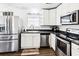 Efficient kitchen with stainless steel appliances and white cabinetry at 4437 Garwood Dr, Ladson, SC 29456