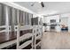 A kitchen and dining area with stainless steel appliances, white cabinets, and dark wood flooring at 4437 Garwood Dr, Ladson, SC 29456