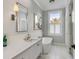 Bright bathroom with soaking tub, marble countertop, and modern fixtures at 49 Ashley Ave, Charleston, SC 29401