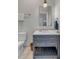 Bathroom features a modern vanity with marble countertop and stylish fixtures at 49 Ashley Ave, Charleston, SC 29401