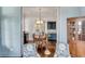 Dining room with elegant lighting, stylish furniture, and seamless flow to the living spaces at 49 Ashley Ave, Charleston, SC 29401