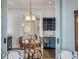 Open dining area view into bar area with wine storage and a light blue cabinet at 49 Ashley Ave, Charleston, SC 29401