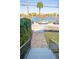 Beautiful brick stairway leading to the street with water view, lovely landscaping, and greenery at 49 Ashley Ave, Charleston, SC 29401