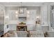 Modern kitchen featuring custom cabinets, marble countertops and stainless steel appliances at 49 Ashley Ave, Charleston, SC 29401