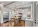 Bright kitchen features modern cabinets, an island with barstool seating, and stylish finishes at 49 Ashley Ave, Charleston, SC 29401