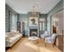 Cozy living room with fireplace, stylish furnishings, and abundant natural light at 49 Ashley Ave, Charleston, SC 29401