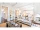 Comfortable living room with hardwood floors and seamless flow into a modern white kitchen at 49 Ashley Ave, Charleston, SC 29401