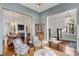 Open-concept living space showcasing seamless flow to dining area and staircase at 49 Ashley Ave, Charleston, SC 29401