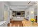 Open-concept living area with a view of the built in shelving unit, and hardwood flooring at 49 Ashley Ave, Charleston, SC 29401