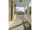 Charming yellow porch with white posts and railing, and view of waterfront at 49 Ashley Ave, Charleston, SC 29401