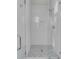 Clean shower with white tile and modern fixtures plus elegant tile floor at 49 Ashley Ave, Charleston, SC 29401