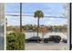 Scenic view of the waterfront from a window, showcasing lush greenery and parked vehicles at 49 Ashley Ave, Charleston, SC 29401
