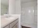 Well-lit bathroom with vanity, white shower surround, and luxury vinyl plank flooring at 551 Gahagan Rd, Summerville, SC 29486
