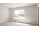 Well-lit bedroom features a large window offering pleasant natural light and an outdoor view at 551 Gahagan Rd, Summerville, SC 29486
