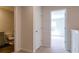 Hallway features a linen closet and view to sunlit bedroom with neutral walls and carpet at 551 Gahagan Rd, Summerville, SC 29486