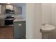 The kitchen has modern stainless appliances, light gray cabinets and countertops, shown from the entryway at 551 Gahagan Rd, Summerville, SC 29486