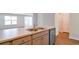 A kitchen is shown with stainless steel appliances, light grey cabinets, and a large stainless steel sink at 551 Gahagan Rd, Summerville, SC 29486