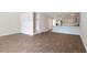 Spacious living room and staircase in a new home featuring wood look floors and white walls at 551 Gahagan Rd, Summerville, SC 29486