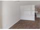 A living room has wood laminate flooring and access to the kitchen area in a modern new home at 551 Gahagan Rd, Summerville, SC 29486