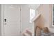 Bright entryway featuring a front door, window, and bench with decorative pillows, steps to second floor at 553 Gahagan Rd, Summerville, SC 29486