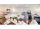 Open-concept space with a modern kitchen, dining area, and a comfortable living room at 555 Gahagan Rd, Summerville, SC 29486