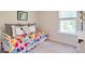 Cozy bedroom featuring a colorful bed and lots of natural light at 557 Gahagan Rd, Summerville, SC 29486