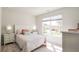 Bedroom with large window and neutral decor overlooking the outside at 559 Gahagan Rd, Summerville, SC 29486