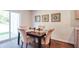 Cozy dining room featuring a dark wood table, upholstered chairs, and natural light at 559 Gahagan Rd, Summerville, SC 29486