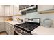 Close-up of kitchen featuring stainless steel appliances, white cabinets, and modern finishes at 559 Gahagan Rd, Summerville, SC 29486