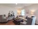 Bright living room with neutral tones, modern decor, stylish furniture, and wood-look floors at 559 Gahagan Rd, Summerville, SC 29486