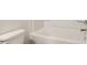 Modern bathroom features a white bathtub with chrome fixtures and wall mounted shower head at 561 Gahagan Rd, Summerville, SC 29486