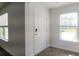 Entryway with a digital lock door, two windows and wood-look flooring at 561 Gahagan Rd, Summerville, SC 29486