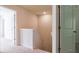 Upstairs hallway with neutral walls, trim, and carpet; doorway leads to additional rooms at 561 Gahagan Rd, Summerville, SC 29486