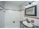 Comfortable bathroom featuring a shower and tub combination, and a vanity with sink at 5823 Lakeview Dr, Hanahan, SC 29410