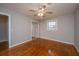 Bedroom features wood floors, neutral walls, closet and bright windows at 5823 Lakeview Dr, Hanahan, SC 29410