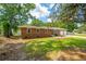 Brick house showcasing the side and front, complemented by green lawn at 5823 Lakeview Dr, Hanahan, SC 29410