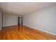 Open living space with gleaming hardwood floors and neutral paint at 5823 Lakeview Dr, Hanahan, SC 29410