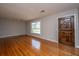 Bright living room with hardwood floors and a decorative front door at 5823 Lakeview Dr, Hanahan, SC 29410