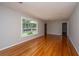 Sun-filled living room with polished hardwood floors and ample natural light at 5823 Lakeview Dr, Hanahan, SC 29410