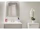 Bathroom featuring a modern vanity with stylish mirror and white flower decoration at 6279 Lucille Dr # B, North Charleston, SC 29406
