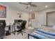 Inviting bedroom with modern decor, multiple desks, a bed and stylish accents at 6279 Lucille Dr # B, North Charleston, SC 29406