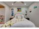 Well-lit bedroom featuring two closets, decorative artwork and a door to the bathroom and stairs at 6279 Lucille Dr # B, North Charleston, SC 29406