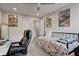 Well-lit bedroom with a bed, desk, and decorative wall art for a personalized touch at 6279 Lucille Dr # B, North Charleston, SC 29406
