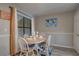 Charming dining area with round table, four chairs, and bright window at 6279 Lucille Dr # B, North Charleston, SC 29406